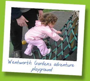 My daughter on a climbing frame at Wentworth Gardens Adventure playground